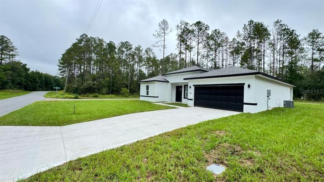 Front exterior of a new home in , Citrus Springs, FL, highlighting curb appeal (Image 2).