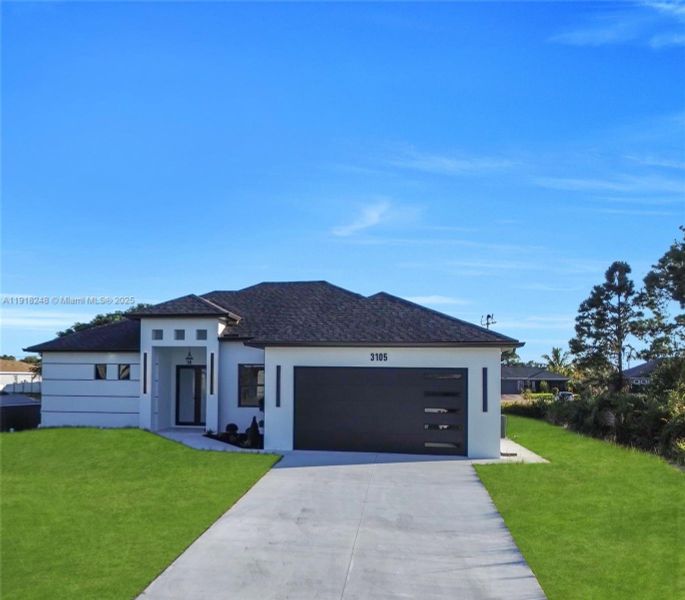 Front exterior of a new home in , Lehigh Acres, FL, highlighting curb appeal (Image 2). Front exterior of a new home in , Lehigh Acres, FL, highlighting curb appeal (Image 2).