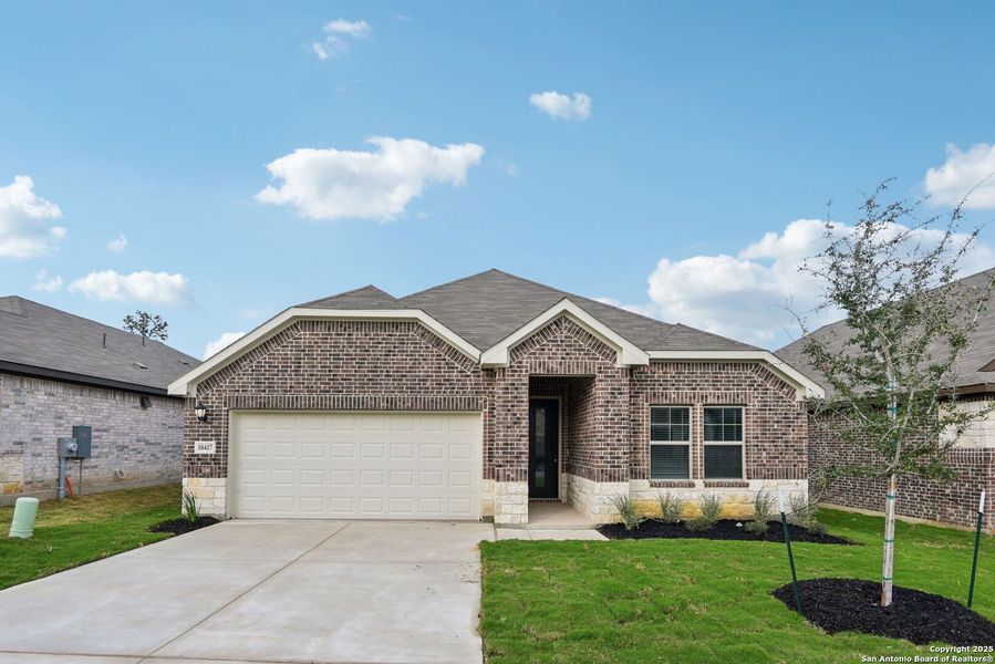 Front exterior of a new home in Fox Falls, Boerne, TX, highlighting curb appeal (Image 23).