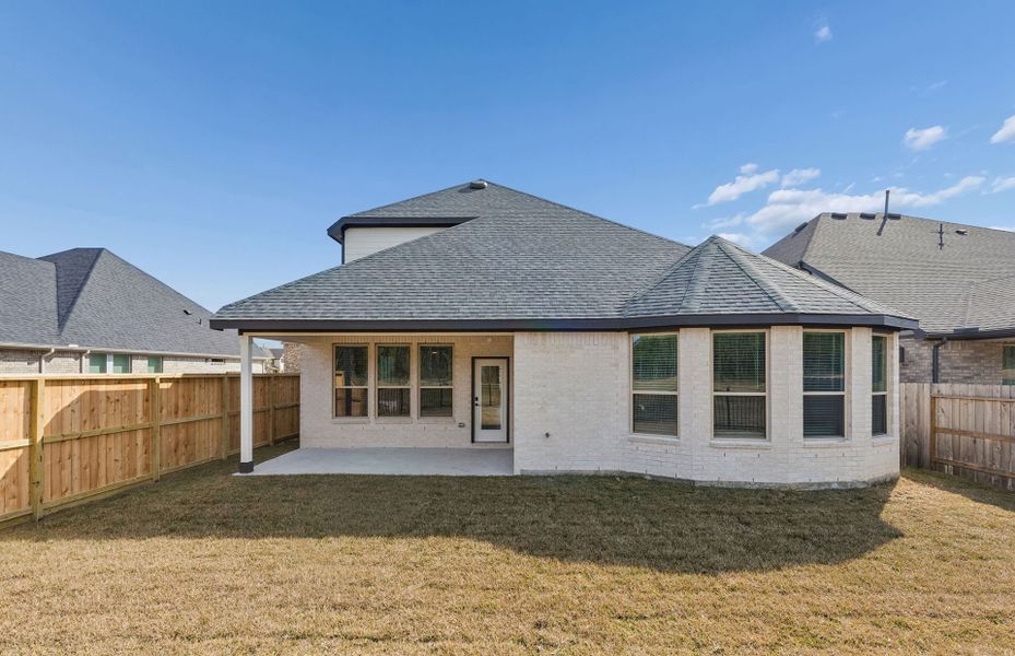 Exterior details and patio area of a home in Mavera, Conroe (Image 22).