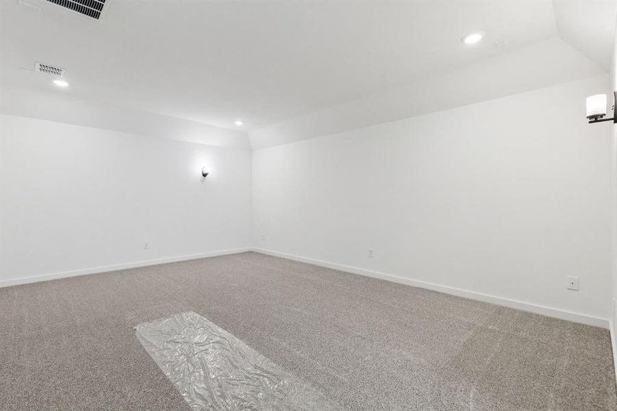 The spacious media room with adjacent oversized game room create the ultimate entertainment zone!