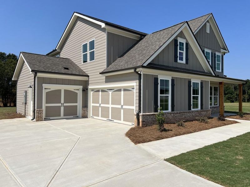 Front exterior of a new home in , Good Hope, GA, highlighting curb appeal (Image 15). Front exterior of a new home in , Good Hope, GA, highlighting curb appeal (Image 15).