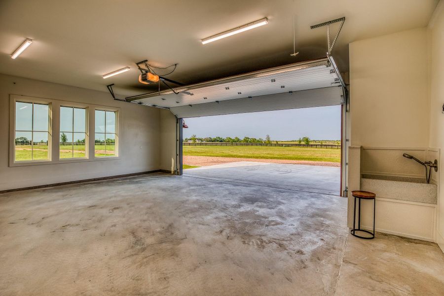 Garage featuring baseboards Garage featuring baseboards