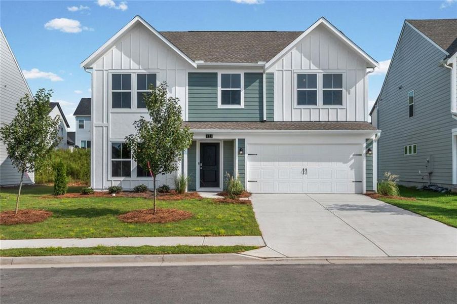 Front exterior of a new home in Twin Lakes, Hoschton, GA, highlighting curb appeal (Image 16).