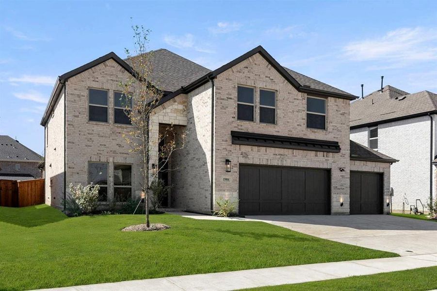 Front exterior of a new home in Valencia on The Lake, Little Elm, TX, highlighting curb appeal (Image 2).