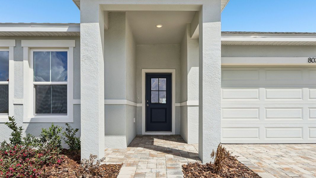 Representative exterior photo of a completed home built from the Castaway Multi-Gen by DRB Homes in Hamilton Bluff, Haines City, FL (Image 22).