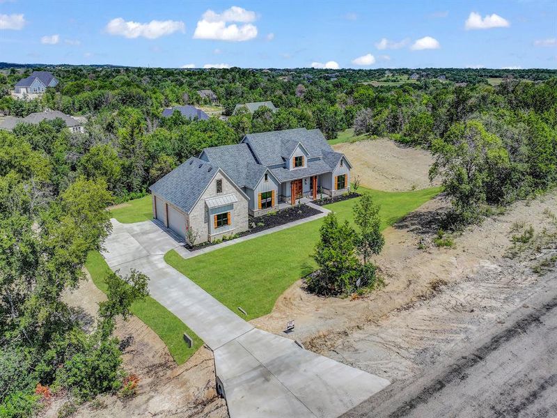 Front exterior of a new home in , Weatherford, TX, highlighting curb appeal (Image 1). Front exterior of a new home in , Weatherford, TX, highlighting curb appeal (Image 1).