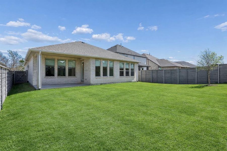 Exterior details and patio area of a home in , Little Elm (Image 22).