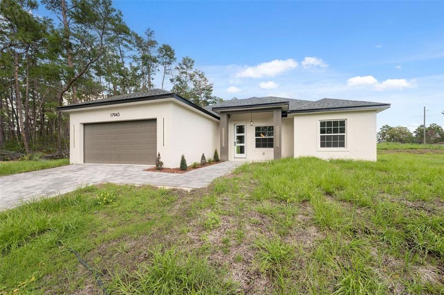 Front exterior of a new home in , Ocala, FL, highlighting curb appeal (Image 20). Front exterior of a new home in , Ocala, FL, highlighting curb appeal (Image 20).