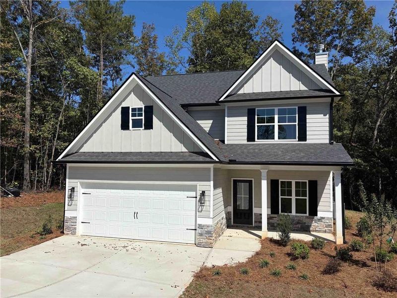 Front exterior of a new home in Benson Estates, Dallas, GA, highlighting curb appeal (Image 1). Front exterior of a new home in Benson Estates, Dallas, GA, highlighting curb appeal (Image 1).
