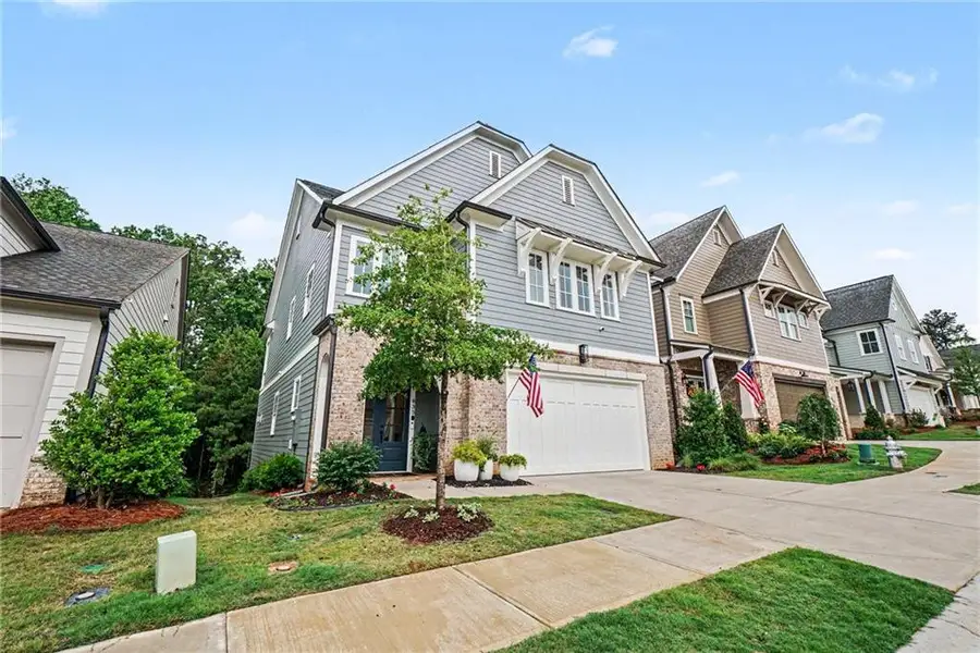 Front exterior of a new home in Lakeside at River Green, Canton, GA, highlighting curb appeal (Image 1). Front exterior of a new home in Lakeside at River Green, Canton, GA, highlighting curb appeal (Image 1).