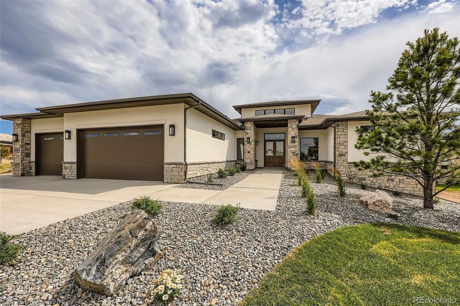 Front exterior of a new home in , Parker, CO, highlighting curb appeal (Image 25).