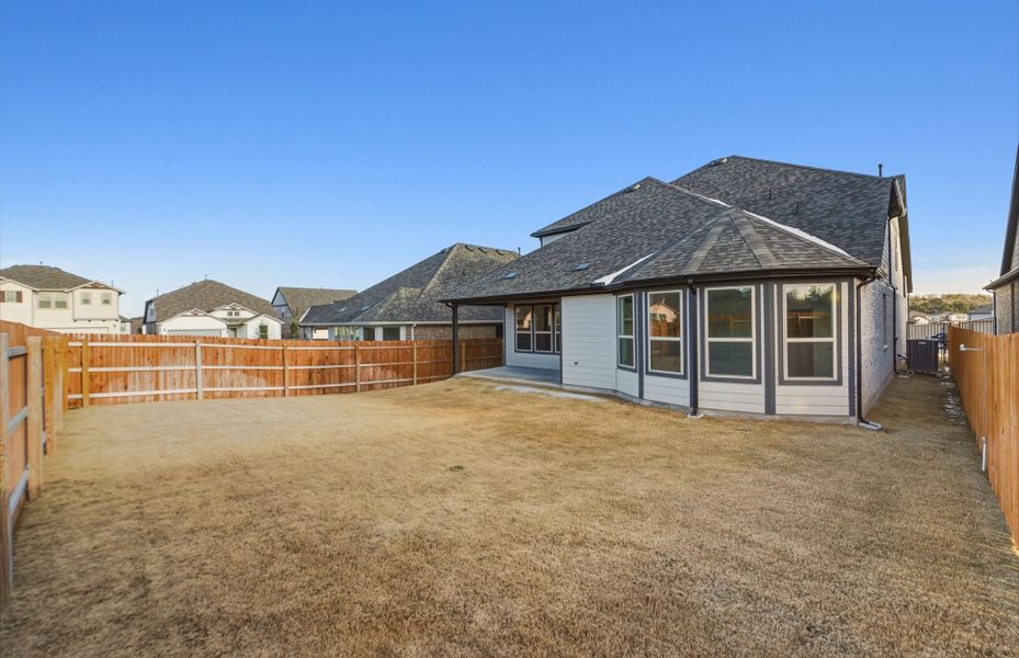 Exterior details and patio area of a home in Saddleback at Santa Rita Ranch, Liberty Hill (Image 22). Exterior details and patio area of a home in Saddleback at Santa Rita Ranch, Liberty Hill (Image 22).
