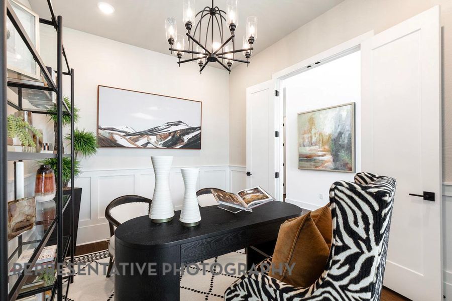 Office with a chandelier, a wainscoted wall, a decorative wall, and recessed lighting