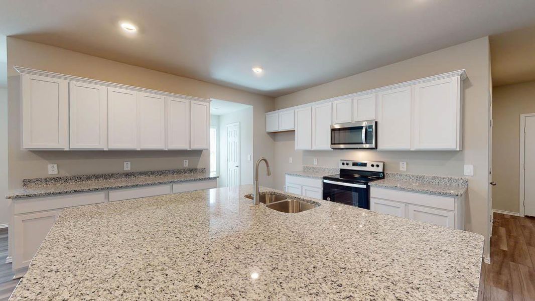 Kitchen featuring white cabinetry, light wood-style flooring, electric range oven, and recessed lighting
