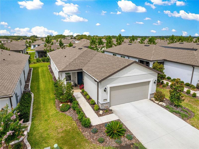 Front exterior of a new home in Del Webb Stone Creek, Ocala, FL, highlighting curb appeal (Image 21).