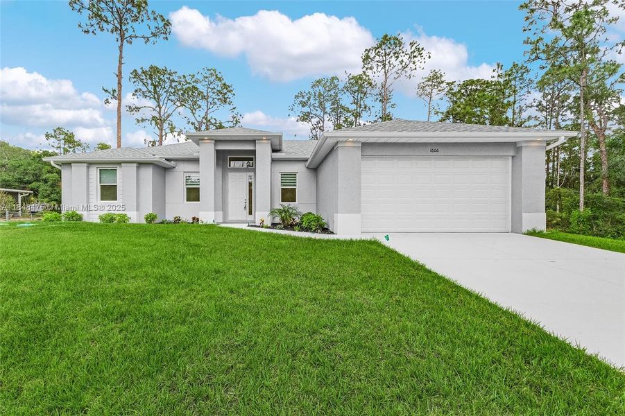 Front exterior of a new home in , Lehigh Acres, FL, highlighting curb appeal (Image 1). Front exterior of a new home in , Lehigh Acres, FL, highlighting curb appeal (Image 1).