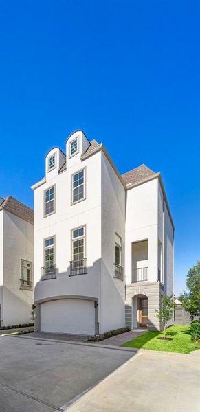 Jamye floor plan is three stories with a small balcony off the second floor.