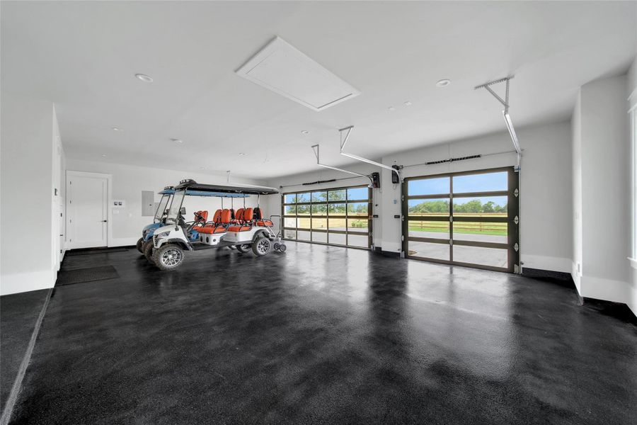 Three car garage with soft close doors.  Tall openings for those Big Texas Trucks and toys. Concrete is coated, stalls are deep.