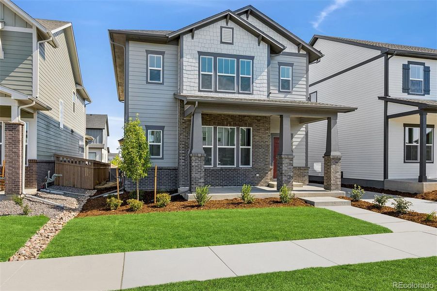 Front exterior of a new home in Painted Prairie Cottage, Aurora, CO, highlighting curb appeal (Image 21).
