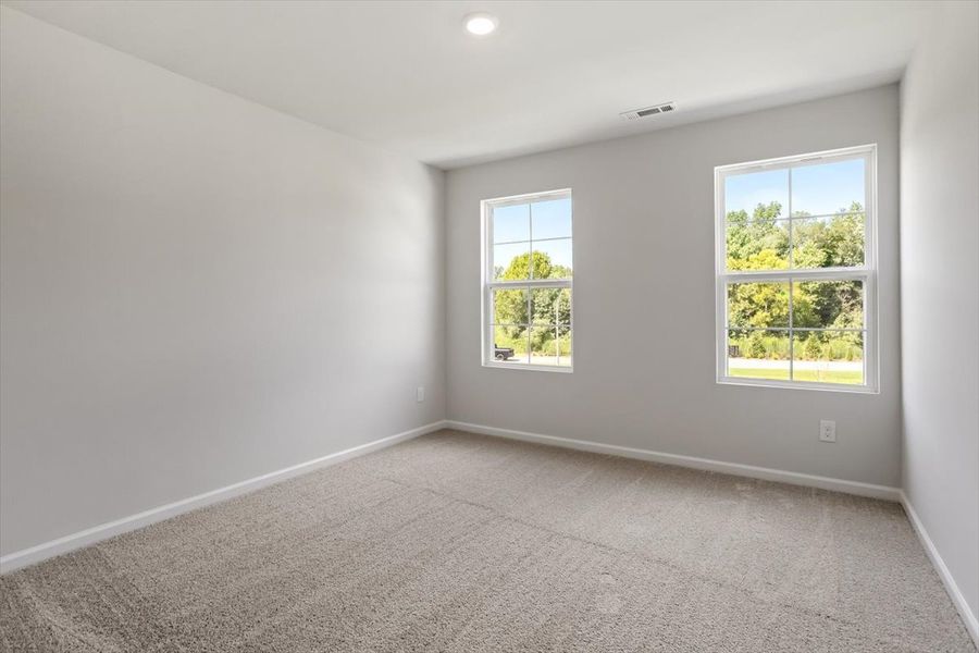 Spacious, unfurnished interior of a new home in Cambridge Reserve, Angier (Image 34).