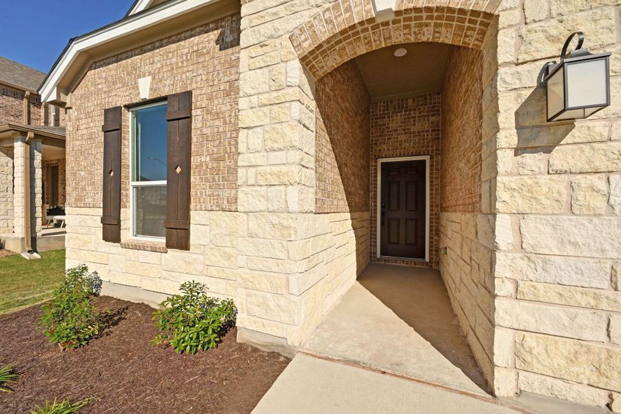 Exterior details and patio area of a home in Salerno - Classic Collection, Round Rock (Image 20).
