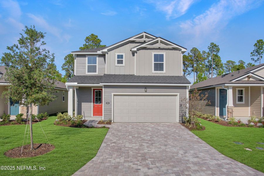 Front exterior of a new home in RiverTown - Forest, St. Johns, FL, highlighting curb appeal (Image 15). Front exterior of a new home in RiverTown - Forest, St. Johns, FL, highlighting curb appeal (Image 15).