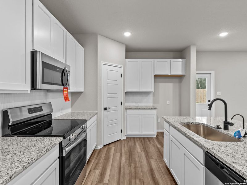 Furnished interior view inside a new home in Royal Crest, San Antonio (Image 7).