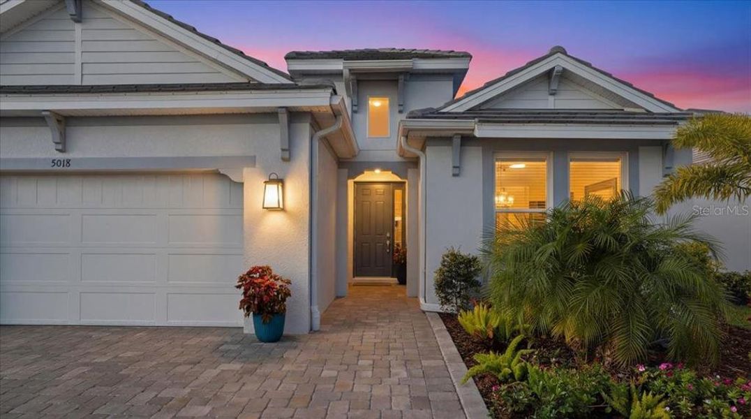 Front exterior of a new home in Esplanade at Artisan Lakes, Palmetto, FL, highlighting curb appeal (Image 21).