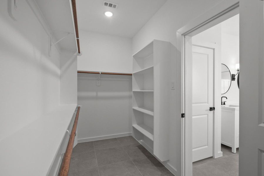 Spacious walk-in closet in the primary suite