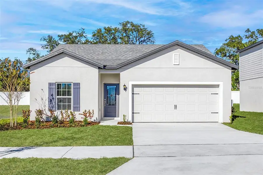 Front exterior of a new home in Tula Parc, Astatula, FL, highlighting curb appeal (Image 1). Front exterior of a new home in Tula Parc, Astatula, FL, highlighting curb appeal (Image 1).
