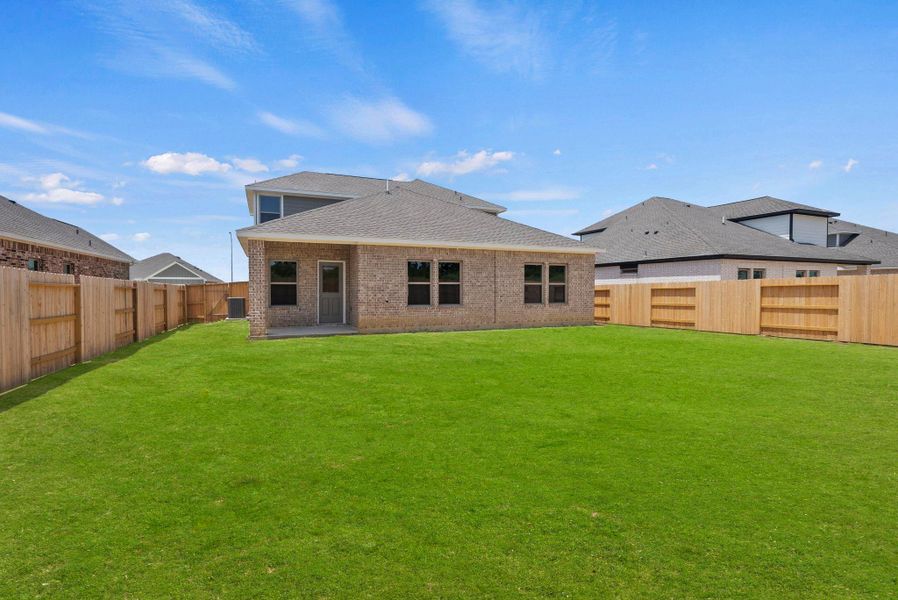 Exterior details and patio area of a home in Windcress, Cove (Image 25).