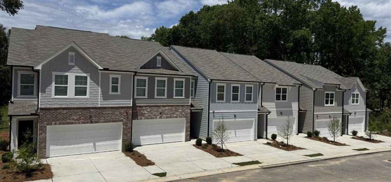 Front exterior of a new home in Chestnut Grove, Douglasville, GA, highlighting curb appeal (Image 2). Front exterior of a new home in Chestnut Grove, Douglasville, GA, highlighting curb appeal (Image 2).