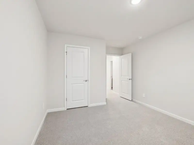 Spacious, unfurnished interior of a new home in Country Lane - Signature Series, Clayton (Image 23).
