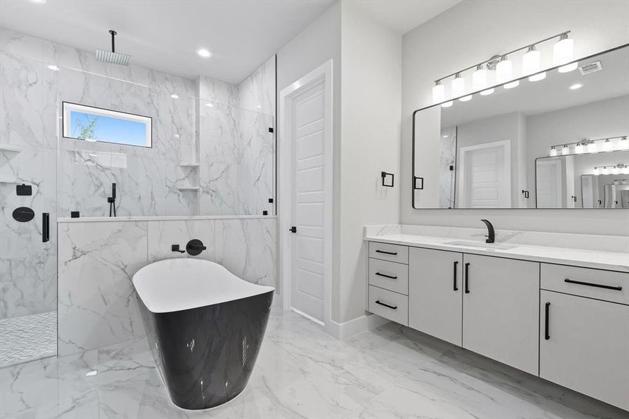 Bathroom with a soaking tub, vanity, a marble finish shower, light marble finish flooring, and recessed lighting