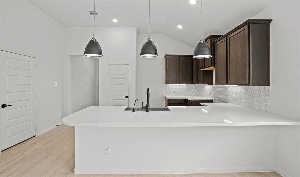 Elegant lighting in kitchen (*Photo not of actual home and used for illustration purposes only.)