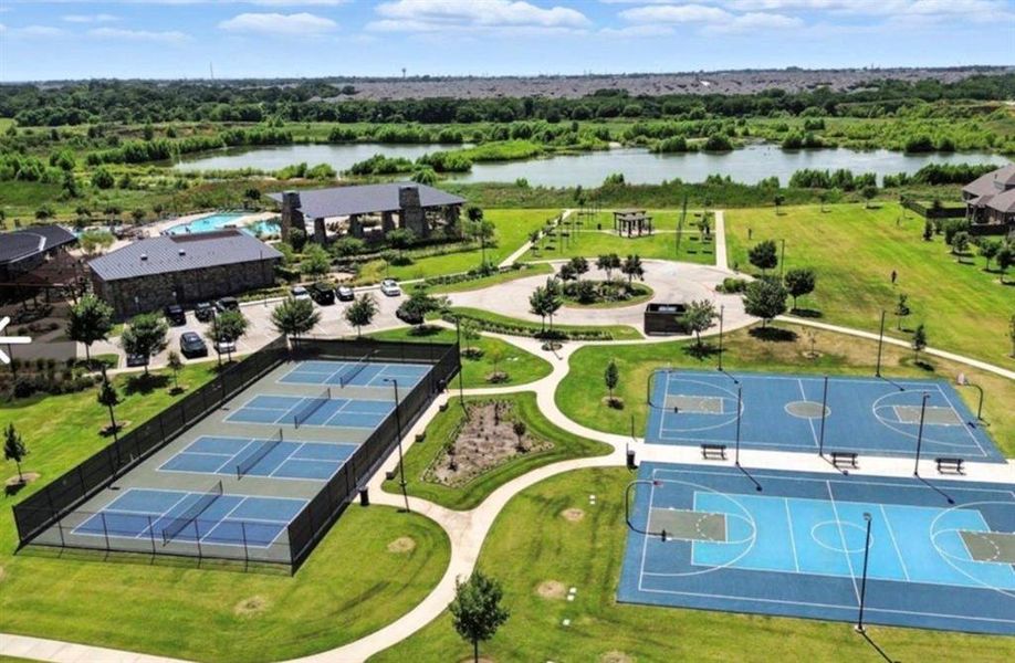 Community amenities featuring multiple sports courts, a structured playground, and a central clubhouse with a swimming pool Community amenities featuring multiple sports courts, a structured playground, and a central clubhouse with a swimming pool