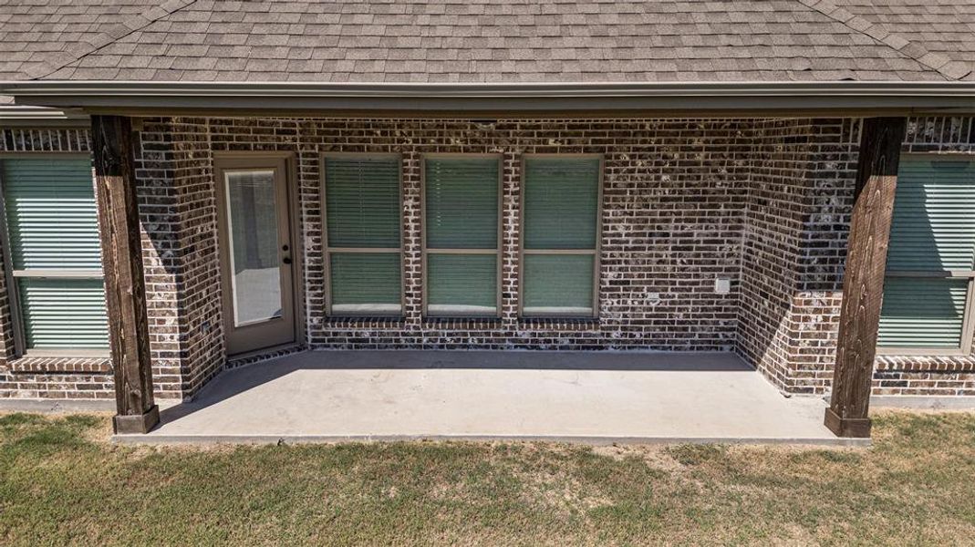 Property entrance featuring a patio area