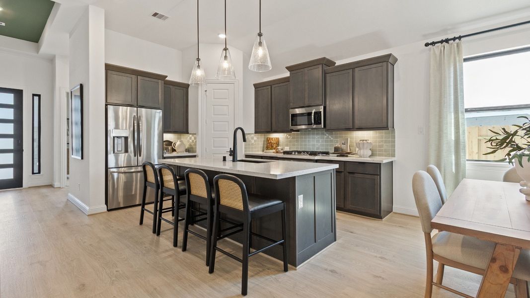 Representative furnished interior of a home built from the Oleander by Brightland Homes in Sunterra, Katy (Image 5).