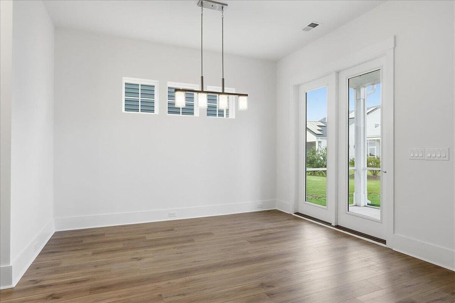 Spacious, unfurnished interior of a new home in Summerwind Crossing at Lakes of Cane Bay, Summerville (Image 10).