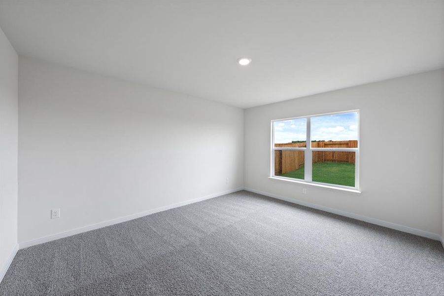 Empty room featuring carpet floors and recessed lighting Empty room featuring carpet floors and recessed lighting