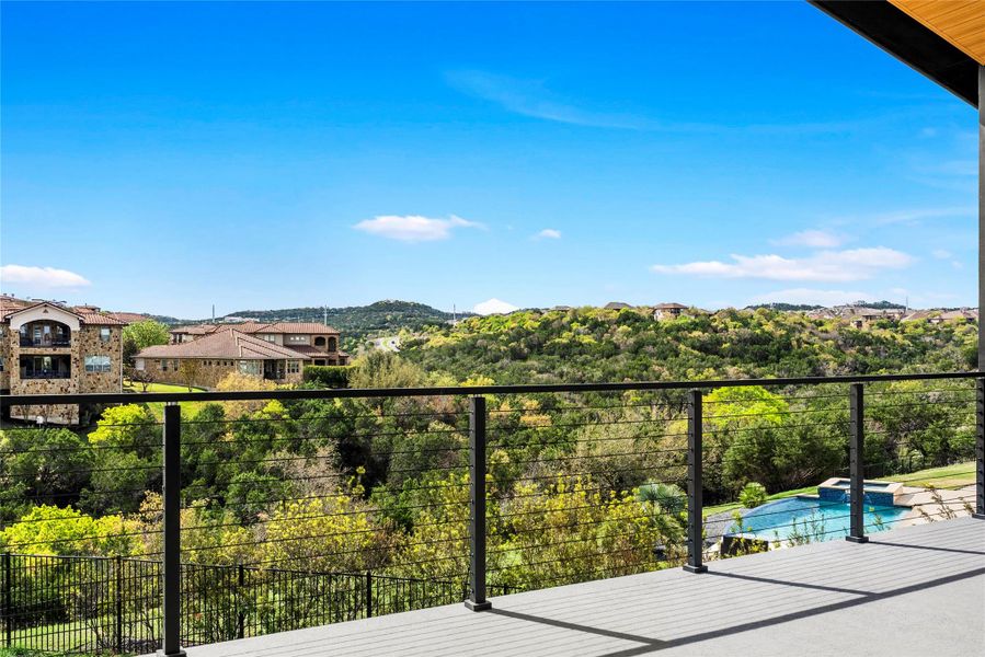 Balcony with a pool with connected hot tub and view of pool area Balcony with a pool with connected hot tub and view of pool area