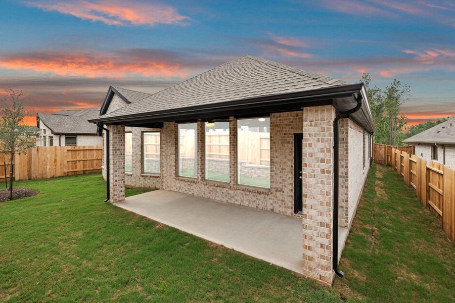 Exterior details and patio area of a home in Wildtree, Magnolia (Image 22).