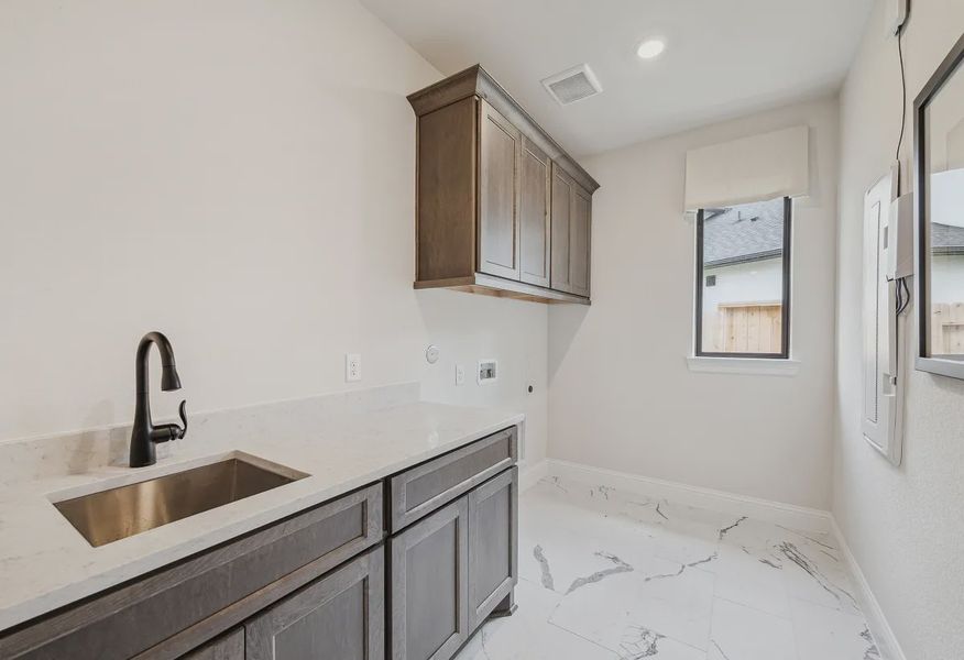 Plan 4043 laundry room - staged - 11 of 19 Plan 4043 laundry room - staged - 11 of 19