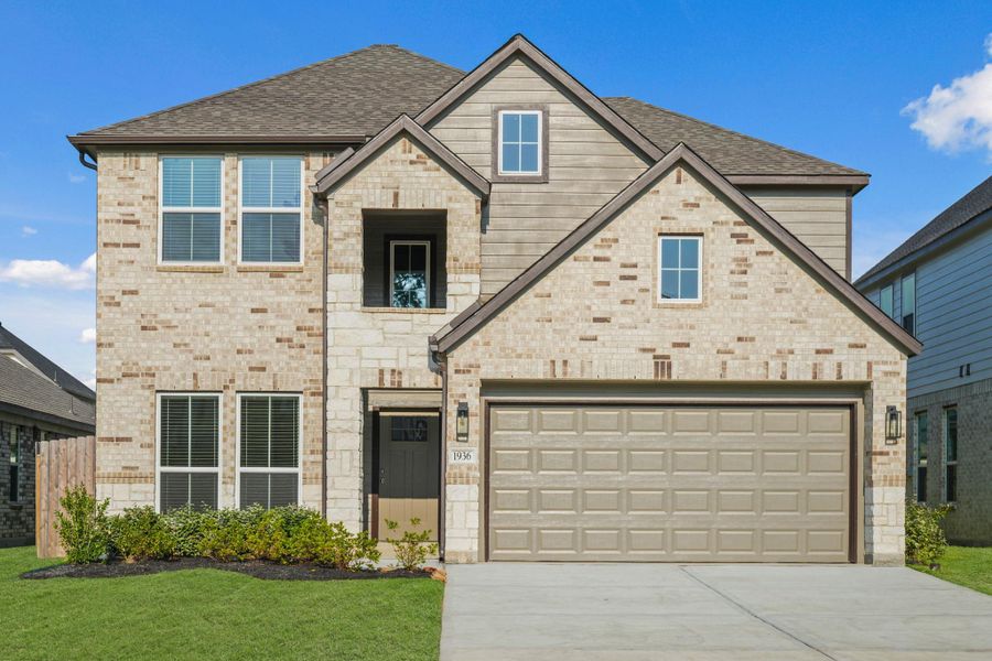 Front exterior of a new home in Barton Creek Ranch, Conroe, TX, highlighting curb appeal (Image 2). Front exterior of a new home in Barton Creek Ranch, Conroe, TX, highlighting curb appeal (Image 2).
