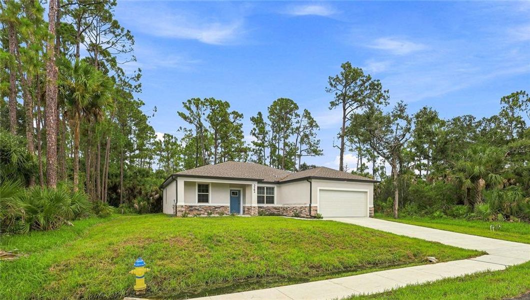Front exterior of a new home in , North Port, FL, highlighting curb appeal (Image 15).