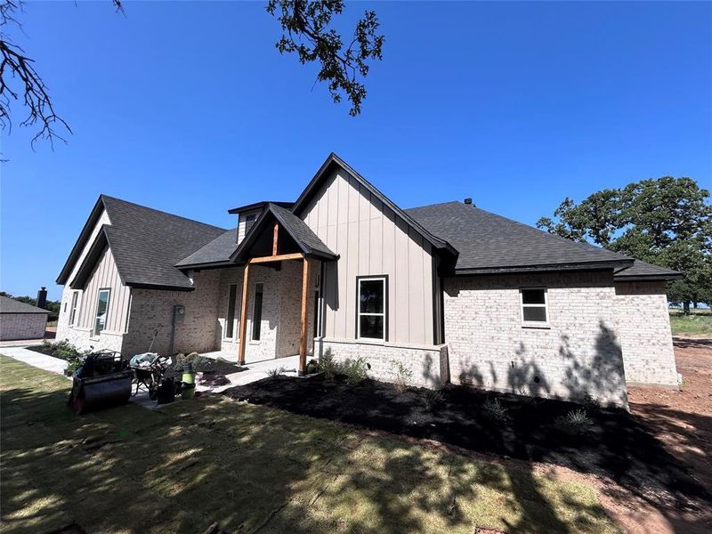 Exterior details and patio area of a home in , Poolville (Image 3).