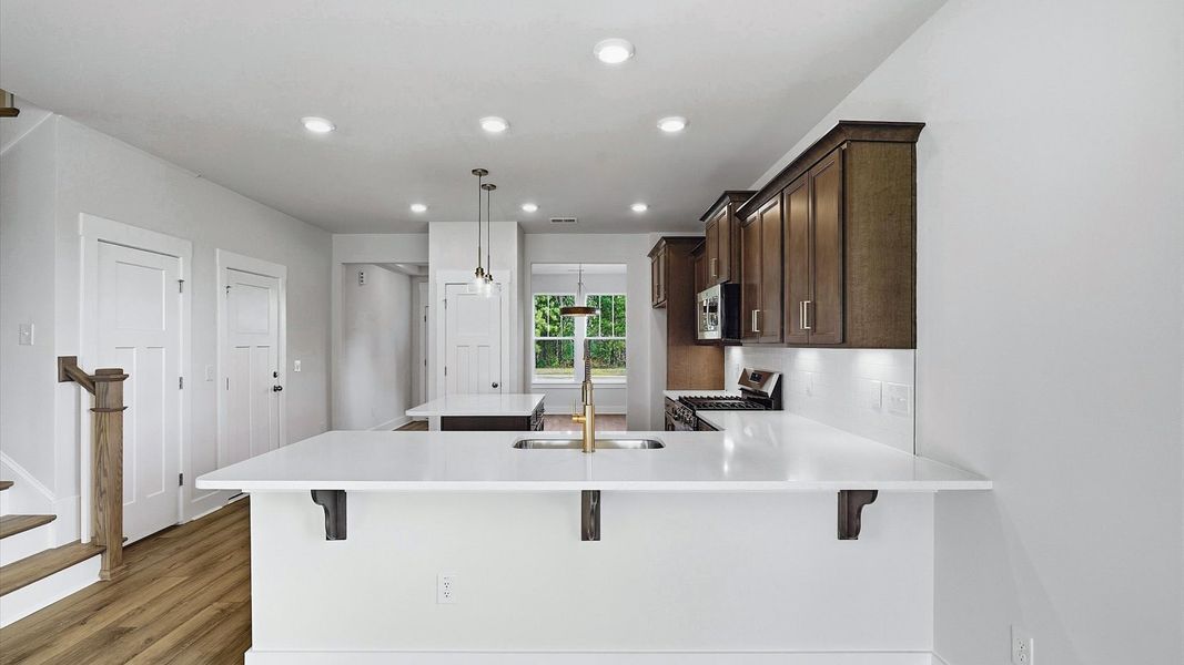 Beautifully appointed kitchen with spacious counters and sophisticated detailing Beautifully appointed kitchen with spacious counters and sophisticated detailing