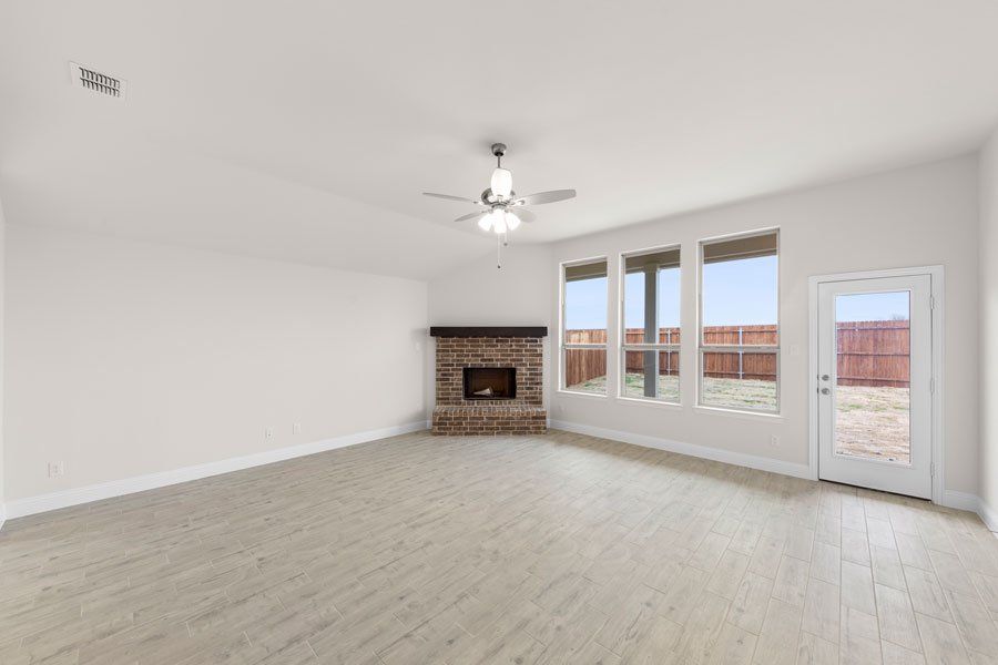 Representative exterior photo of a completed home built from the Kingston by Impression Homes in Timberbrook, Justin, TX (Image 14).