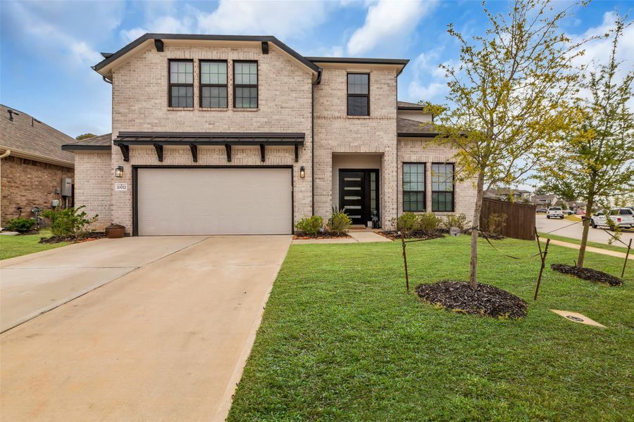 Front exterior of a new home in Fairwater, Montgomery, TX, highlighting curb appeal (Image 1).